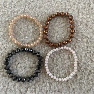 4 Piece Beaded Bracelet Set In Bronze, White, Nude, and Black